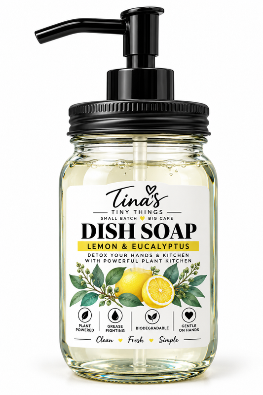 Tina's Tiny Things Lemon & Eucalyptus Liquid Dish Soap in a clear glass mason jar with black pump dispenser, featuring a white botanical label with fresh lemons, eucalyptus leaves, and yellow accents against a clean white background.