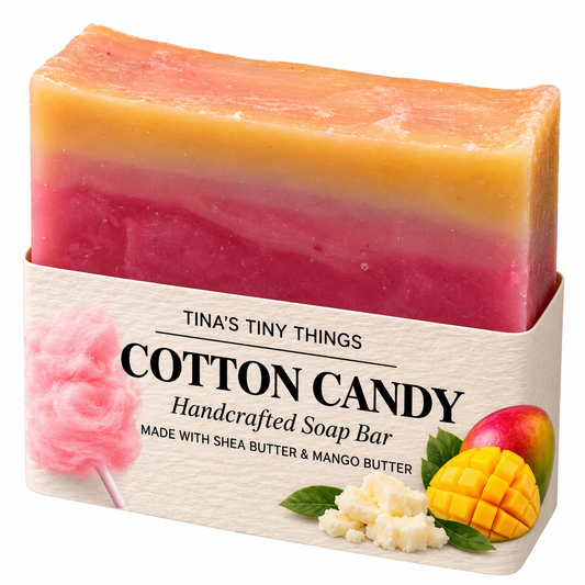 Tina's Tiny Things Cotton Candy Handmade Soap Bar featuring vibrant pink, red, and golden-yellow layers, made with shea butter and mango butter, with decorative cotton candy and mango packaging.
