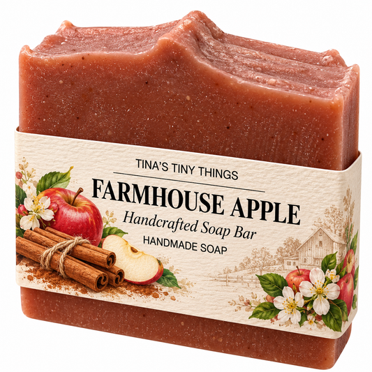 Tina's Tiny Things Farmhouse Apple Handmade Soap Bar featuring a reddish-brown artisan soap with a textured top and decorative packaging featuring red apples, cinnamon sticks, and farmhouse-inspired artwork.