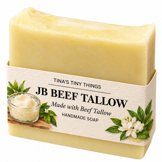 Tina's Tiny Things JB Beef Tallow Handmade Soap Bar featuring a creamy golden-yellow artisan soap with a textured top and decorative botanical packaging, named in honor of the maker's father.