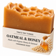 Tina's Tiny Things Oatmeal & Honey Handmade Soap Bar made with organic honey and oatmeal, featuring a golden honey-colored soap with a honeycomb-inspired top and cream packaging decorated with honey, oats, and wheat illustrations.