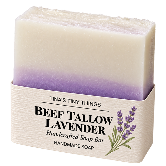 Tina's Tiny Things Beef Tallow Lavender Handmade Soap Bar featuring creamy white and purple layers, a textured top, and lavender botanical packaging.